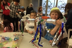 purim party kids making groggers